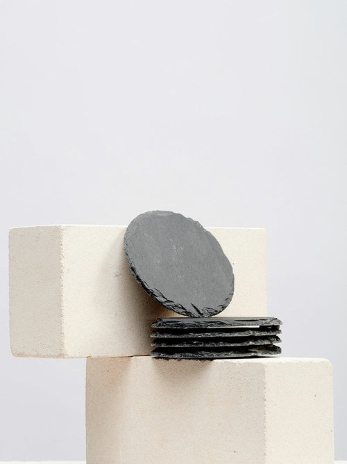 Hand-chipped black slate coasters